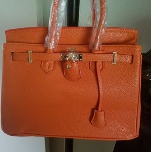 Orange handbag with lock